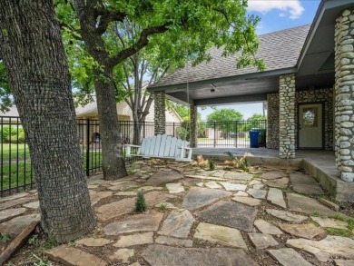 This stunning home, located at the corner of holes 15 and 16 on The Lake Country Club - Lake Waco in Texas - for sale on GolfHomes.com, golf home, golf lot