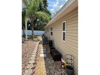 Nestled on a lot you will truly enjoy this spacious two bedroom on Deer Creek RV Golf Resort in Florida - for sale on GolfHomes.com, golf home, golf lot