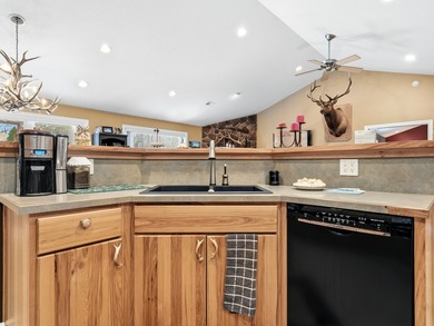 Welcome to this beautifully crafted riverfront home along the on Thunder Bay Golf Resort in Michigan - for sale on GolfHomes.com, golf home, golf lot