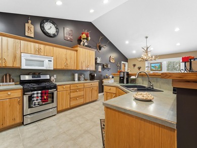 Welcome to this beautifully crafted riverfront home along the on Thunder Bay Golf Resort in Michigan - for sale on GolfHomes.com, golf home, golf lot