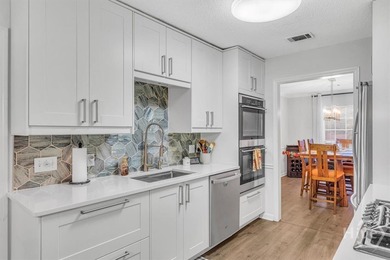 Classic all-brick home perfectly positioned on Hole 1 of the on Cherokee Rose Country Club in Georgia - for sale on GolfHomes.com, golf home, golf lot