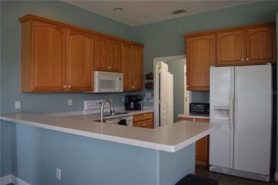 This Pool Home offers picturesque golf course views and features on Tampa Bay Golf and Country Club in Florida - for sale on GolfHomes.com, golf home, golf lot
