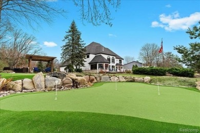 This unique Canadian Lakes waterfront estate offers an exquisite on Canadian Lakes Country Club-The Highlands Course in Michigan - for sale on GolfHomes.com, golf home, golf lot