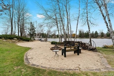 This unique Canadian Lakes waterfront estate offers an exquisite on Canadian Lakes Country Club-The Highlands Course in Michigan - for sale on GolfHomes.com, golf home, golf lot