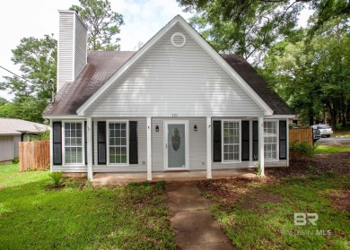 This Charming Two Story Cottage Is The Perfect Place To Call on Lake Forest Yacht and Country Club in Alabama - for sale on GolfHomes.com, golf home, golf lot