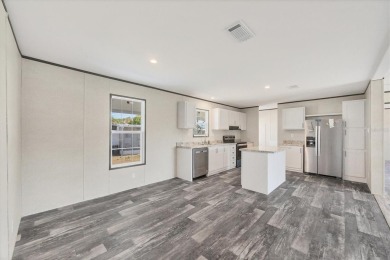 Beautiful brand new 2025 Champion home located in an extremely on Sabal Trace Golf and Country Club in Florida - for sale on GolfHomes.com, golf home, golf lot
