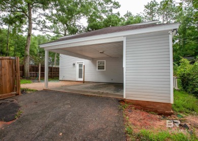 This Charming Two Story Cottage Is The Perfect Place To Call on Lake Forest Yacht and Country Club in Alabama - for sale on GolfHomes.com, golf home, golf lot