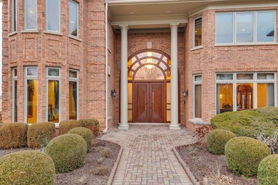 Incredible all-brick 5-bedroom, 5.2-bath home nestled on a quiet on The Merit Club in Illinois - for sale on GolfHomes.com, golf home, golf lot