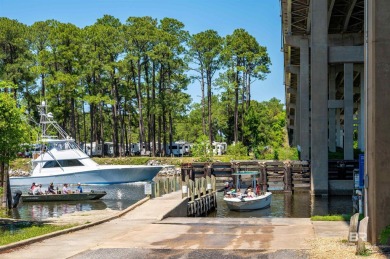 BUILDER WILL INCLUDE REFRIGERATOR AND BLINDS FOR ANY BUYER WHO on The Golf Club of the Wharf in Alabama - for sale on GolfHomes.com, golf home, golf lot
