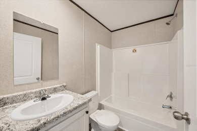 Beautiful brand new 2025 Champion home located in an extremely on Sabal Trace Golf and Country Club in Florida - for sale on GolfHomes.com, golf home, golf lot