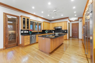 Incredible all-brick 5-bedroom, 5.2-bath home nestled on a quiet on The Merit Club in Illinois - for sale on GolfHomes.com, golf home, golf lot