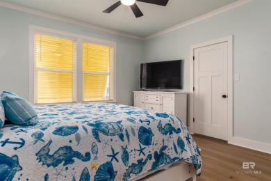 Fall in love with this gorgeous beach house situated on on Isle Dauphine Club Golf Course in Alabama - for sale on GolfHomes.com, golf home, golf lot