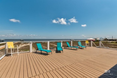 Fall in love with this gorgeous beach house situated on on Isle Dauphine Club Golf Course in Alabama - for sale on GolfHomes.com, golf home, golf lot