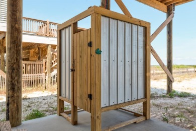 Fall in love with this gorgeous beach house situated on on Isle Dauphine Club Golf Course in Alabama - for sale on GolfHomes.com, golf home, golf lot