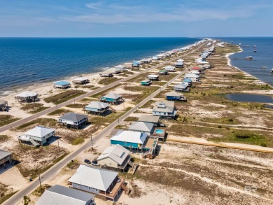 Fall in love with this gorgeous beach house situated on on Isle Dauphine Club Golf Course in Alabama - for sale on GolfHomes.com, golf home, golf lot