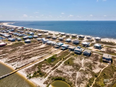 Fall in love with this gorgeous beach house situated on on Isle Dauphine Club Golf Course in Alabama - for sale on GolfHomes.com, golf home, golf lot