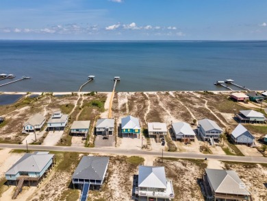Fall in love with this gorgeous beach house situated on on Isle Dauphine Club Golf Course in Alabama - for sale on GolfHomes.com, golf home, golf lot