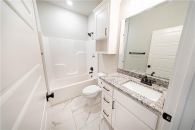 Needs paint, flooring and light deferred maintenance. Short sale on Bella Vista - Metfield Golf Complex and Country Club in Arkansas - for sale on GolfHomes.com, golf home, golf lot