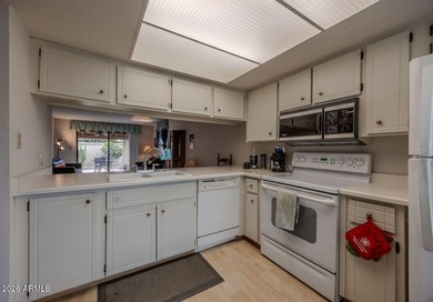 Located in the gated 55+ community of Fountain of the Sun, this on Fountain of the Sun Country Club in Arizona - for sale on GolfHomes.com, golf home, golf lot