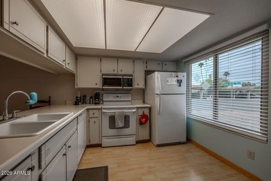 Located in the gated 55+ community of Fountain of the Sun, this on Fountain of the Sun Country Club in Arizona - for sale on GolfHomes.com, golf home, golf lot