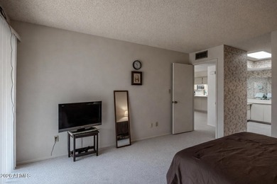 Located in the gated 55+ community of Fountain of the Sun, this on Fountain of the Sun Country Club in Arizona - for sale on GolfHomes.com, golf home, golf lot