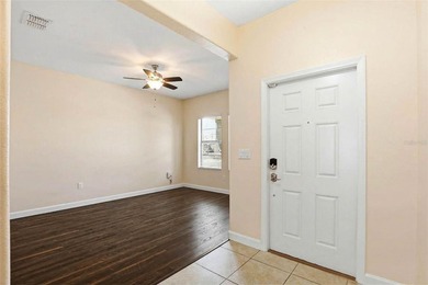 Images have been virtually staged for illustrative purposes on The Groves Golf and Country Club in Florida - for sale on GolfHomes.com, golf home, golf lot