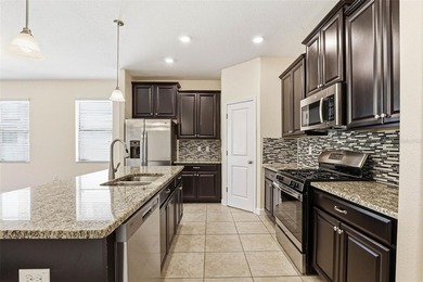 Images have been virtually staged for illustrative purposes on The Groves Golf and Country Club in Florida - for sale on GolfHomes.com, golf home, golf lot