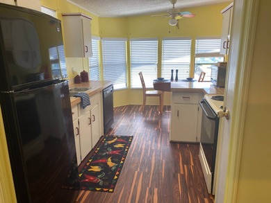 Fully furnished 2/2 home in vibrant 55+ community on leased land on Spanish Lakes Fairways in Florida - for sale on GolfHomes.com, golf home, golf lot