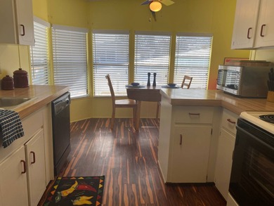 Fully furnished 2/2 home in vibrant 55+ community on leased land on Spanish Lakes Fairways in Florida - for sale on GolfHomes.com, golf home, golf lot