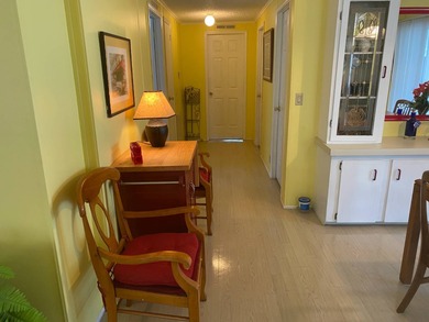 Fully furnished 2/2 home in vibrant 55+ community on leased land on Spanish Lakes Fairways in Florida - for sale on GolfHomes.com, golf home, golf lot