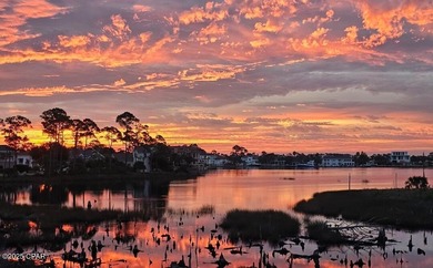 Experience waterfront living in Bay Point with front-row seats on Bay Point Resort Golf Club in Florida - for sale on GolfHomes.com, golf home, golf lot