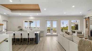 Experience waterfront living in Bay Point with front-row seats on Bay Point Resort Golf Club in Florida - for sale on GolfHomes.com, golf home, golf lot