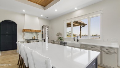 Experience waterfront living in Bay Point with front-row seats on Bay Point Resort Golf Club in Florida - for sale on GolfHomes.com, golf home, golf lot