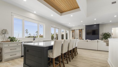 Experience waterfront living in Bay Point with front-row seats on Bay Point Resort Golf Club in Florida - for sale on GolfHomes.com, golf home, golf lot