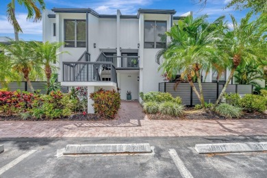 Captivating lakefront and golf views await in this spacious on Boca West Golf and Country Club in Florida - for sale on GolfHomes.com, golf home, golf lot