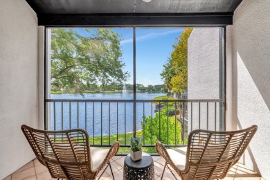 Captivating lakefront and golf views await in this spacious on Boca West Golf and Country Club in Florida - for sale on GolfHomes.com, golf home, golf lot