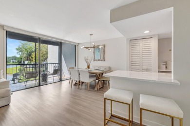 Captivating lakefront and golf views await in this spacious on Boca West Golf and Country Club in Florida - for sale on GolfHomes.com, golf home, golf lot