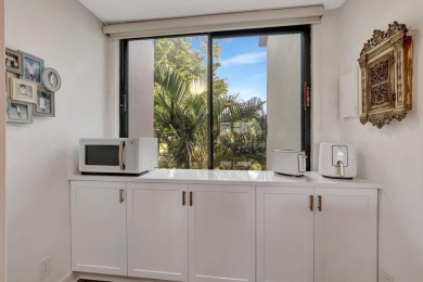 Captivating lakefront and golf views await in this spacious on Boca West Golf and Country Club in Florida - for sale on GolfHomes.com, golf home, golf lot