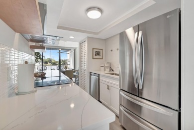 Captivating lakefront and golf views await in this spacious on Boca West Golf and Country Club in Florida - for sale on GolfHomes.com, golf home, golf lot