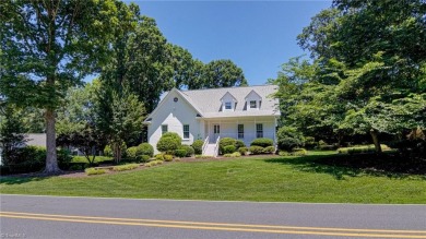Classic white brick beauty nestled on the 16th fairway of Forest on Forest Oaks Country Club in North Carolina - for sale on GolfHomes.com, golf home, golf lot