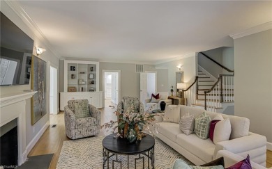 Classic white brick beauty nestled on the 16th fairway of Forest on Forest Oaks Country Club in North Carolina - for sale on GolfHomes.com, golf home, golf lot