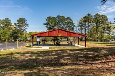 LET THE FUN BEGIN !!  This is a must see !! A cozy getaway at on River Golf and County Club at Lake Royale in North Carolina - for sale on GolfHomes.com, golf home, golf lot