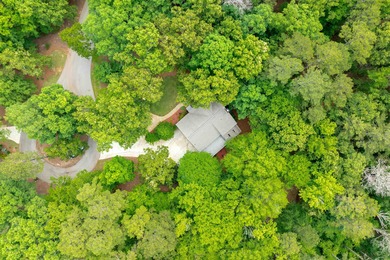 Nestled just off a cul-de-sac on this wooded lot in Reynolds on Reynolds Lake Oconee - The Oconee in Georgia - for sale on GolfHomes.com, golf home, golf lot