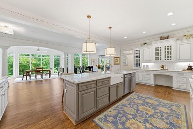 COMMANDING MASSIVE PALATIAL COLUMNS, THIS SUGARLOAF COUNTRY CLUB on TPC At Sugarloaf Golf Club in Georgia - for sale on GolfHomes.com, golf home, golf lot