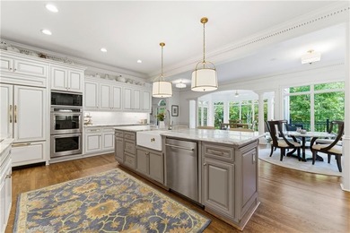 COMMANDING MASSIVE PALATIAL COLUMNS, THIS SUGARLOAF COUNTRY CLUB on TPC At Sugarloaf Golf Club in Georgia - for sale on GolfHomes.com, golf home, golf lot