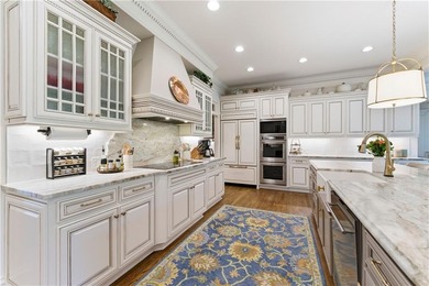 COMMANDING MASSIVE PALATIAL COLUMNS, THIS SUGARLOAF COUNTRY CLUB on TPC At Sugarloaf Golf Club in Georgia - for sale on GolfHomes.com, golf home, golf lot