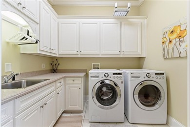 COMMANDING MASSIVE PALATIAL COLUMNS, THIS SUGARLOAF COUNTRY CLUB on TPC At Sugarloaf Golf Club in Georgia - for sale on GolfHomes.com, golf home, golf lot