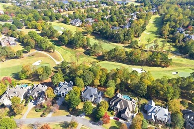 COMMANDING MASSIVE PALATIAL COLUMNS, THIS SUGARLOAF COUNTRY CLUB on TPC At Sugarloaf Golf Club in Georgia - for sale on GolfHomes.com, golf home, golf lot
