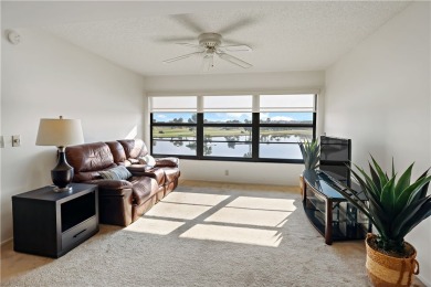 Enjoy resort-style living in this bright 2nd-floor corner unit on Vista Plantation Golf Club in Florida - for sale on GolfHomes.com, golf home, golf lot