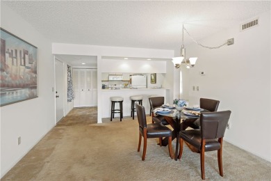 Enjoy resort-style living in this bright 2nd-floor corner unit on Vista Plantation Golf Club in Florida - for sale on GolfHomes.com, golf home, golf lot